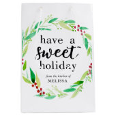 甘いホリデーグッズ焼いたクリスマスリースを持つ ミディアムペーパーバッグ (正面)