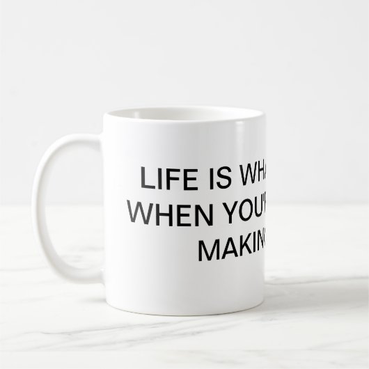 生命はFLANの何が起こるかマグです コーヒーマグカップ (左)