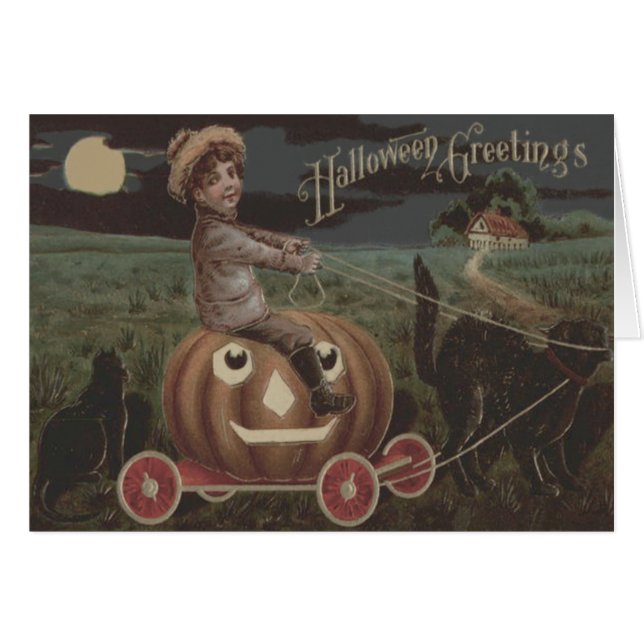 男の子が微笑むハロウィーンのカボチャのちょうちんワゴン黒猫 (正面横)