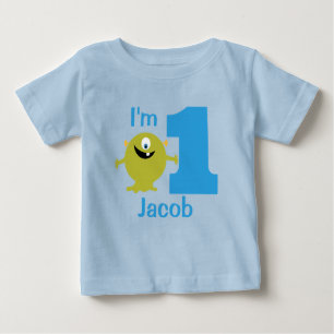 男の子の緑モンスターの第1誕生会のTシャツ ベビーTシャツ