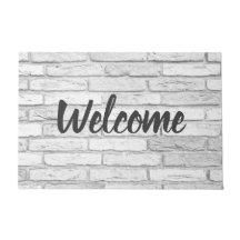 白いおよび灰色の素朴な国の煉瓦歓迎