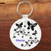 白いキーチェーンに花が黒い蝶 キーホルダー (正面)