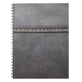 白いステッチで縫った黒い革 ノートブック
