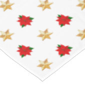 白いテーブルクロスの上のクリスマスのポインセチアと星たち テーブルクロス (アングル)