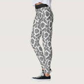 白いドットの黒の幾何学的なパターンのレギング レギンス (左)