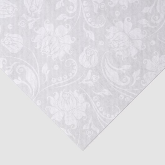 白いフローラが明るい灰色の背景に表示される 薄葉紙 (詳細)