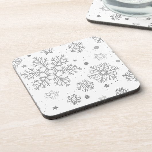 白い上の銀色の雪 コースター (左側)