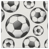 白い分散させた光沢のある円形のサッカーボール ファブリック (クローズアップ)