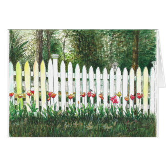 白い塀によるチューリップ