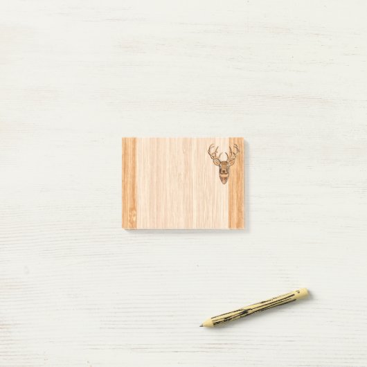白い尾木びき台のシカの頭部の木製の穀物のスタイル ポストイット (デスク上)