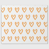 白い手に描かれた黄色のハート ラッピングペーパー (フラット)