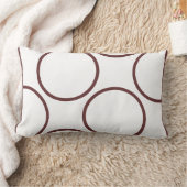 白い枕の上の茶色のモダン円 ランバークッション (ブランケット)