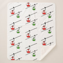 白い毛布の上に赤と緑のゴンドラ