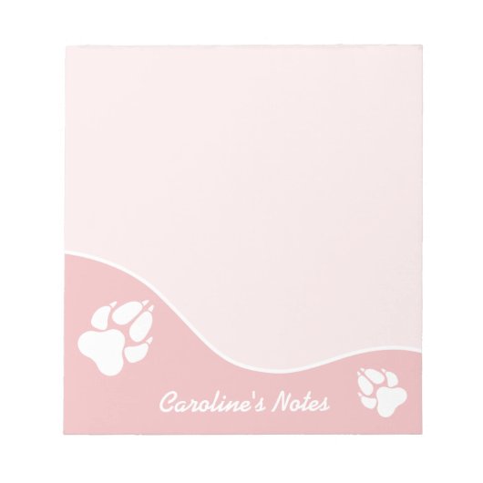 白い犬がピンクに足を伸ばしカスタムてタイトル ノートパッド (正面)