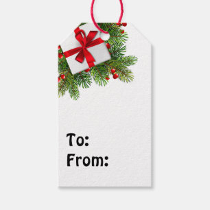 白い現在の赤いリボンを持つクリスマスパイン ギフトタグ