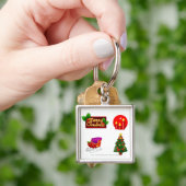 白い背景に対するクリスマスの装飾 キーホルダー (手)