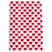 白い背景の赤いハートパターン ミディアムペーパーバッグ (裏面)