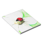 白い花の上絵画のラディバード ノートパッド (アングル)