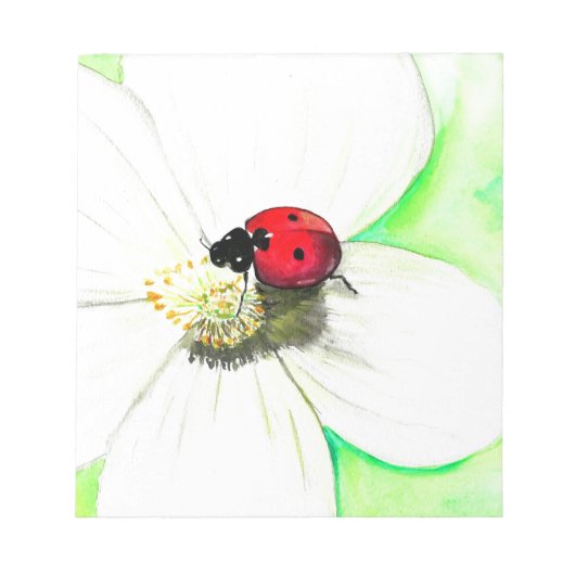 白い花の上絵画のラディバード ノートパッド (正面)