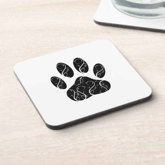 白い花模様の黒犬の前足 コースター (左側)