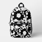 白い花（真珠を黒に付けた） プリントバックパック (正面)