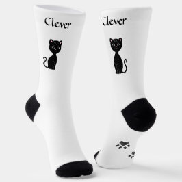 白い靴下の上の愛らしい黒猫と前足 ソックス
