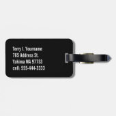 白くおよび黒い輪郭との（紋章の）フラ・ダ・リの金ゴールド ラゲッジタグ (裏面横)