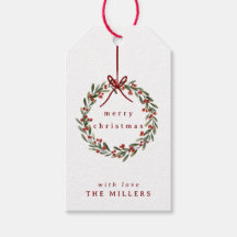 白に赤い弓を付けたクリスマスの葉リース