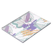 白の上に幾何学的な形状と花。 ノートブック (左側)