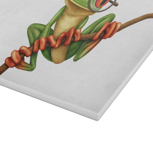 白の目ガラスを持つかわいい緑のアマガエル カッティングボード (角)