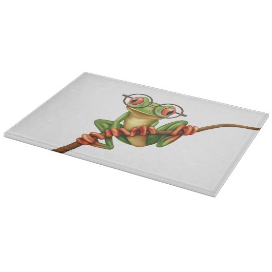 白の目ガラスを持つかわいい緑のアマガエル カッティングボード (角)