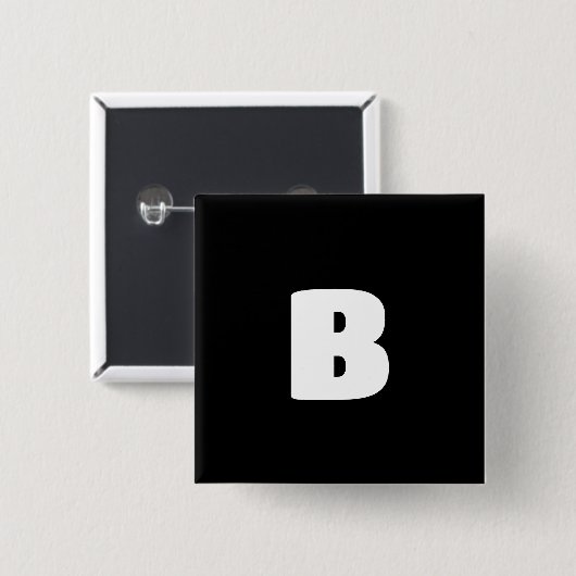白はっきりしたイニシャルオン黒 缶バッジ (正面&裏面)