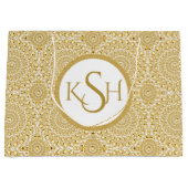 白モノグラムのいダイヤモンドの円パターン上の金ゴールド ラージペーパーバッグ (正面)