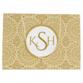 白モノグラムのいダイヤモンドの円パターン上の金ゴールド ラージペーパーバッグ (裏面)