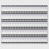 白地に紫のQuadrupletsの文字が入った黒のリボンタイ ラッピングペーパー (フラット)