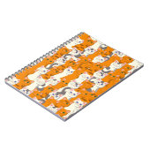 白猫と生姜の猫が緑の目を青く描く ノートブック (左側)