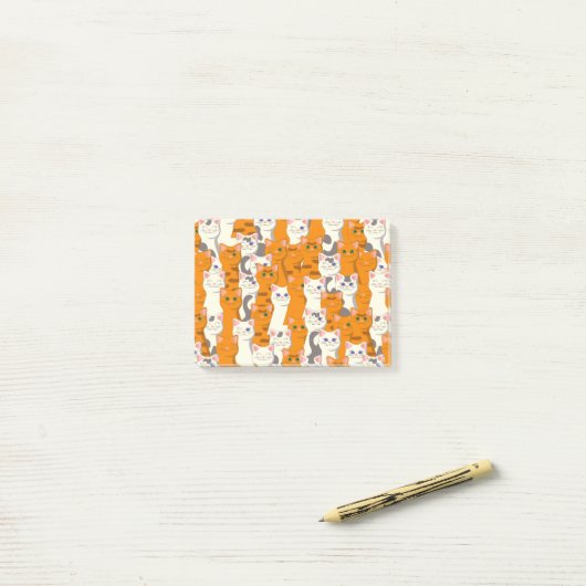 白猫と生姜の猫が緑の目を青く描く ポストイット (デスク上)