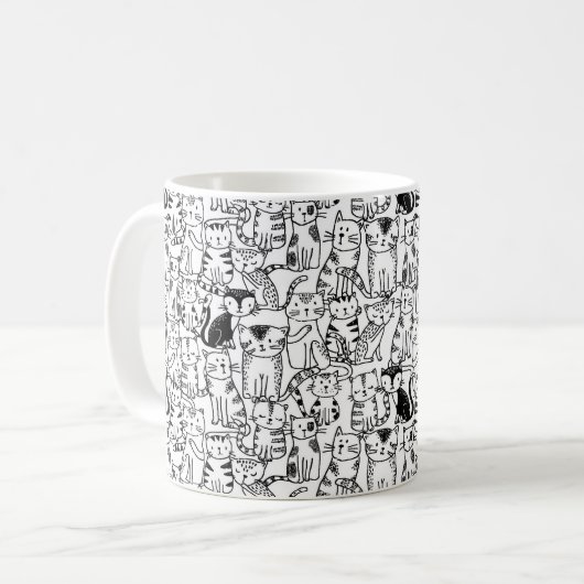 白黒のかわいい手描きの猫のデザイン コーヒーマグカップ (正面左)