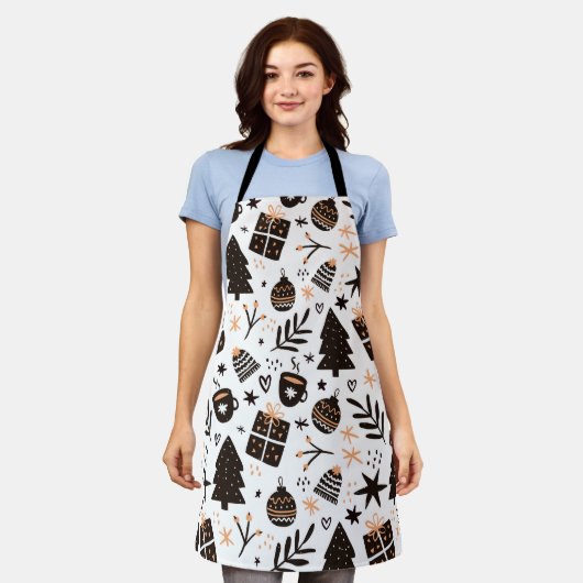 白黒のクリスマスパターン エプロン (着用した状態)