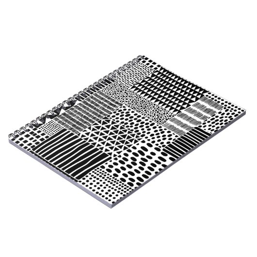 白黒のシームレスなドードルパターン。手で引く ノートブック (左側)