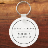 白黒のバイリンガルピーナッツアレルギー警告 キーホルダー (正面)