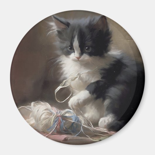 白黒の子猫におもしろいが絡まっている マグネット (正面)