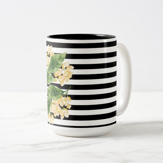 白黒の花に黄色の花を付けストライプる ツートーンマグカップ (正面右)
