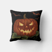 目とこうもりの白熱［赤熱］光を放つ大きなカボチャ クッション (裏面)