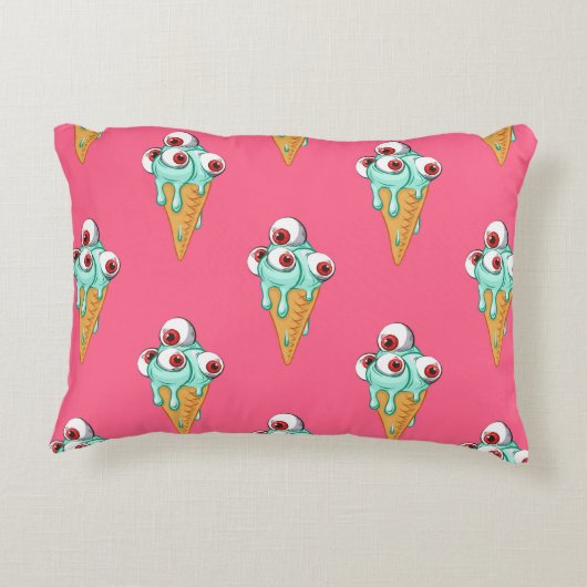 目の付いた青いアイスクリーム。ピンクの背景。シームルズ アクセントクッション (裏面)