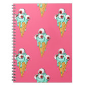 目の付いた青いアイスクリーム。ピンクの背景。シームルズ ノートブック (正面)