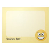 目を開いた顔メモ帳でニヤニヤ ノートパッド (正面)