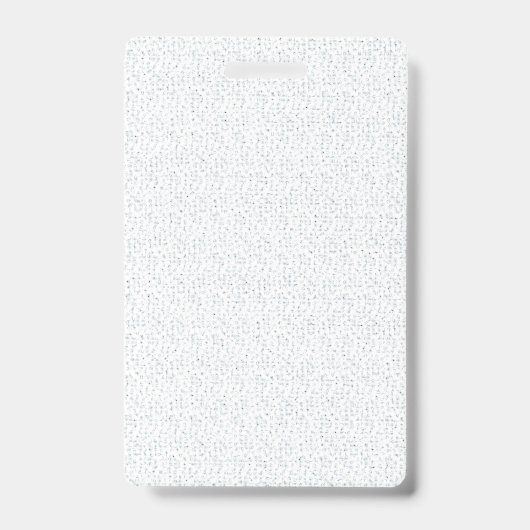 真っ白で特徴のない面が全体に広がっている バッジ (正面)