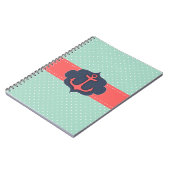 真新しい緑の水玉模様の珊瑚のピンクのいかり ノートブック (左側)