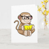 眼鏡と本を持つ学生のサル カード (黄色い花)